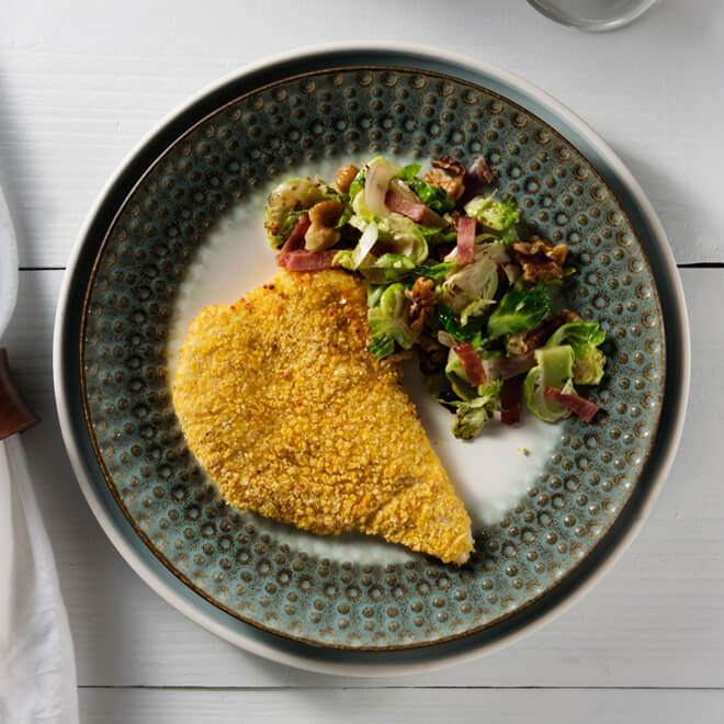 Cornmeal and Parmesan Crusted Chicken Breast with Shredded Brussels and Turkey Bacon