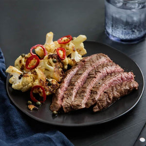 Grass-Fed Flank Steak with Roasted Cauliflower, Capers and Chili