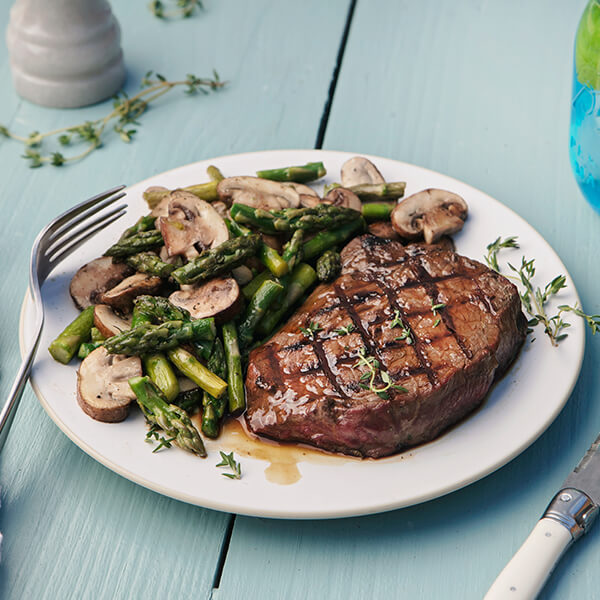 Grilled Grass-Fed Top Steak with Cremini Mushrooms and Asparagus Saute